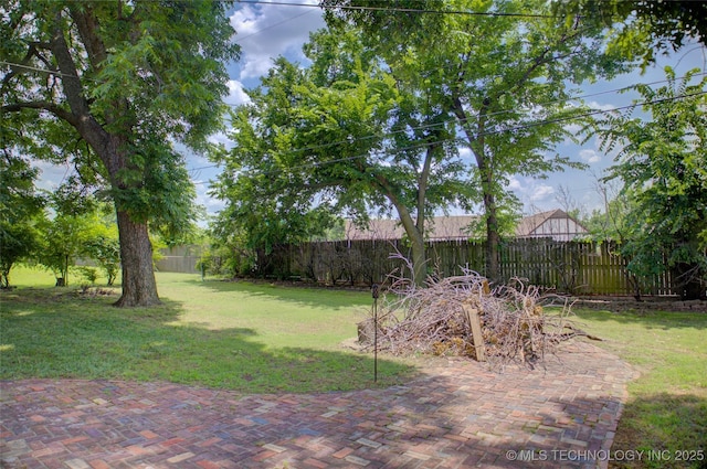 2328 S Delaware Ct, Tulsa, OK 74114 - fenced backyard with a patio area