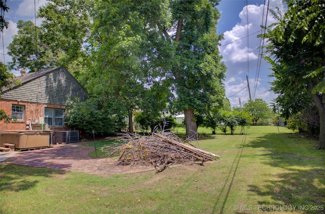2328 S Delaware Ct, Tulsa, OK 74114 - view of grassy yard with a hot tub and a patio area