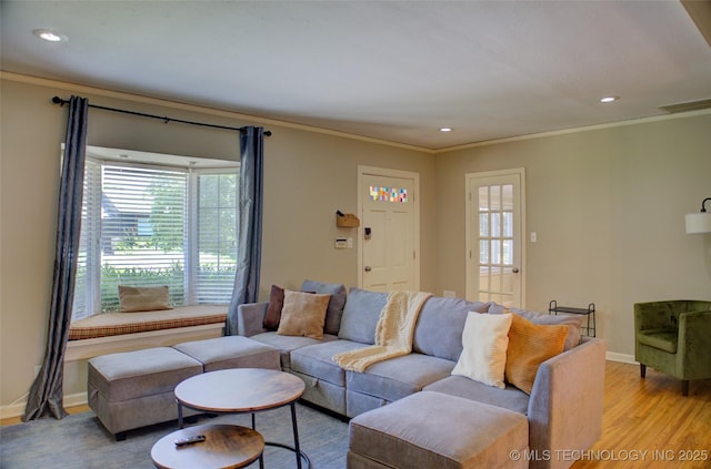 2328 S Delaware Ct, Tulsa, OK 74114 - living room featuring light wood-style floors, healthy amount of natural light, ornamental molding, and recessed lighting