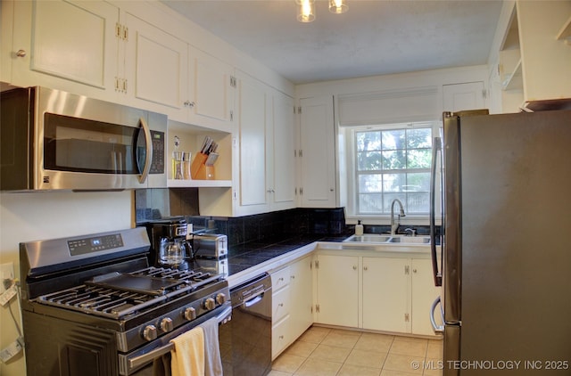 2328 S Delaware Ct, Tulsa, OK 74114 - kitchen with appliances with stainless steel finishes, light tile patterned floors, and white cabinetry