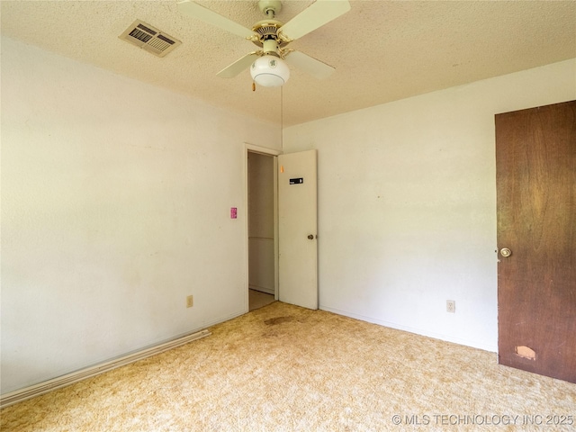 1015 Diehl Ln, Hartshorne, OK 74547 - spare room with carpet floors and a ceiling fan
