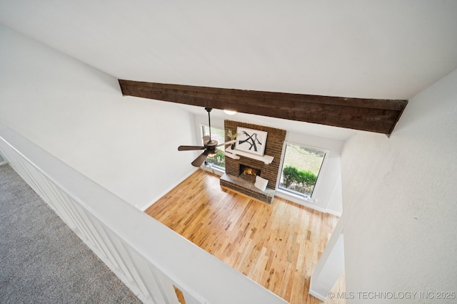 7927 S 86th E Ave, Tulsa, OK 74133 - detailed view of beamed ceiling, a fireplace, wood finished floors, and ceiling fan