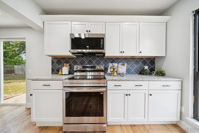 7927 S 86th E Ave, Tulsa, OK 74133 - kitchen with appliances with stainless steel finishes, white cabinets, and decorative backsplash