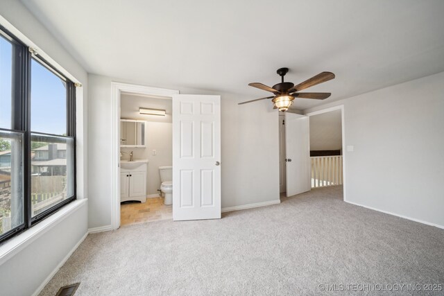 7927 S 86th E Ave, Tulsa, OK 74133 - unfurnished bedroom featuring carpet flooring, ensuite bath, and ceiling fan