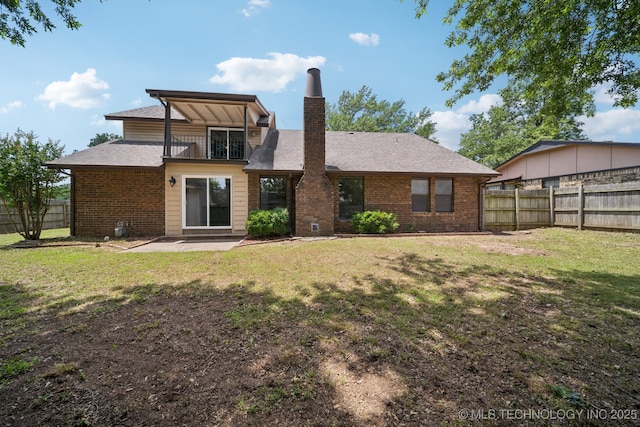 7927 S 86th E Ave, Tulsa, OK 74133 - back of house featuring a fenced backyard, a chimney, brick siding, and a patio