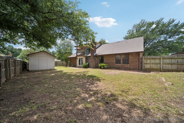7927 S 86th E Ave, Tulsa, OK 74133 - rear view of property with brick siding, a fenced backyard, a shed, and a shingled roof