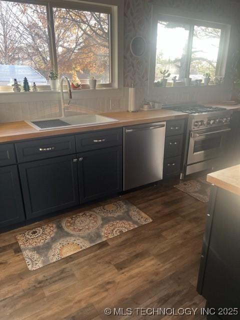 251 Greer Rd, Longtown, OK 74432 - kitchen featuring appliances with stainless steel finishes, dark wood finished floors, and healthy amount of natural light