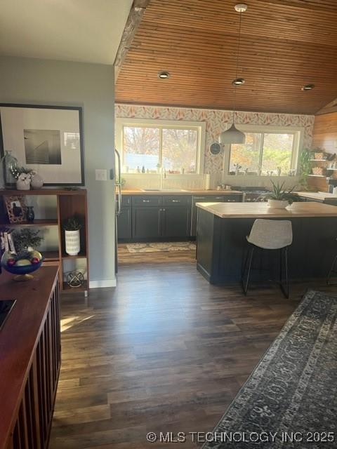 251 Greer Rd, Longtown, OK 74432 - kitchen with dark wood finished floors, wood ceiling, pendant lighting, and dark cabinetry