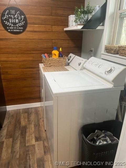 251 Greer Rd, Longtown, OK 74432 - laundry room featuring washer and clothes dryer, wood finished floors, and wooden walls