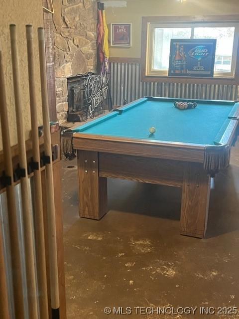 251 Greer Rd, Longtown, OK 74432 - rec room with pool table, concrete flooring, wainscoting, and a stone fireplace