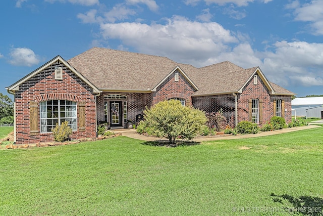 330 Loma Vista Ln, Skiatook, OK 74070 - view of front facade featuring brick siding, a front lawn, and roof with shingles