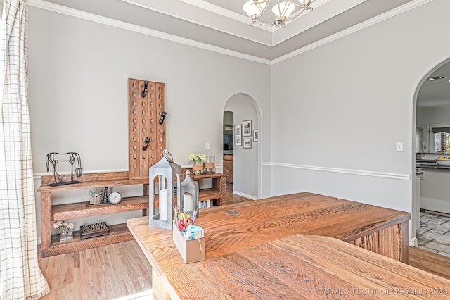 330 Loma Vista Ln, Skiatook, OK 74070 - dining room with arched walkways, a chandelier, wood finished floors, and crown molding