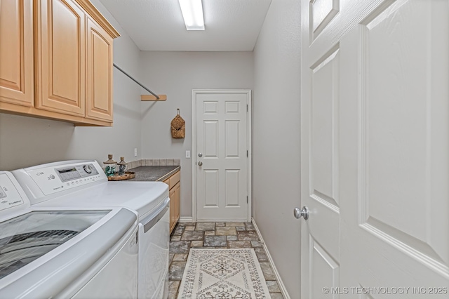 330 Loma Vista Ln, Skiatook, OK 74070 - laundry area featuring separate washer and dryer, cabinet space, and stone tile flooring