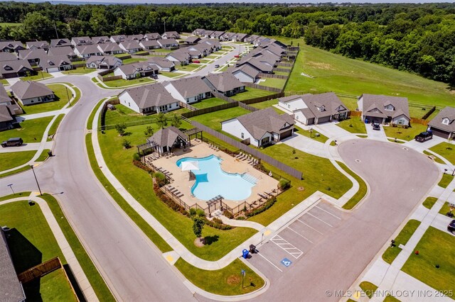 1813 E Van Buren Pl, Broken Arrow, OK 74011 - aerial perspective of suburban area featuring a pool area and a forest