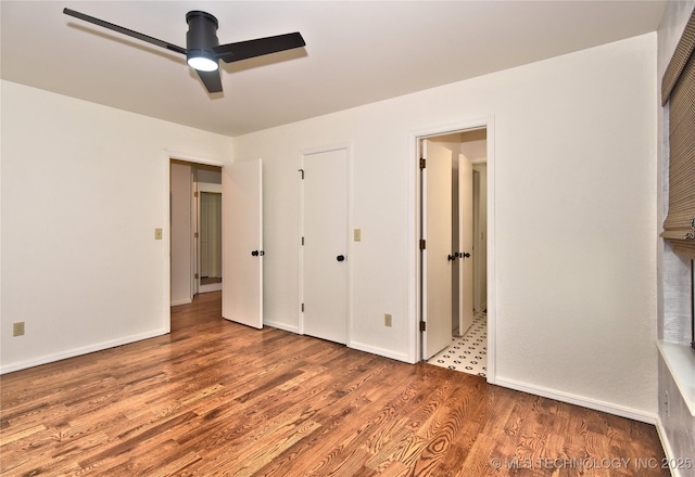 8504 S Winston Ave, Tulsa, OK 74137 - unfurnished bedroom with wood finished floors and ceiling fan