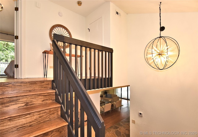 8504 S Winston Ave, Tulsa, OK 74137 - stairway featuring a chandelier