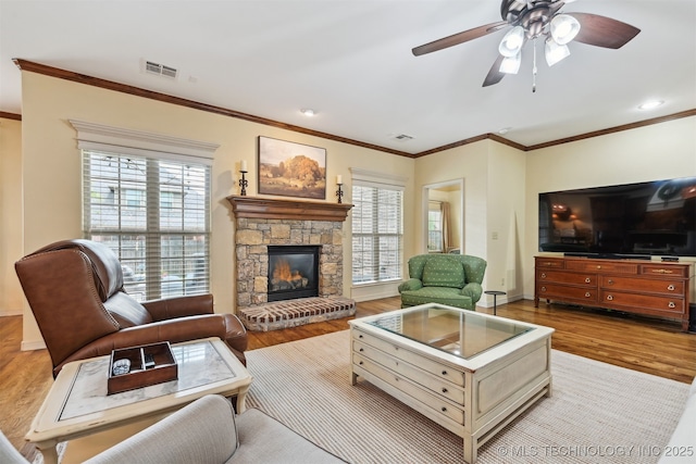 4733 S 167th E Pl, Tulsa, OK 74134 - living area featuring wood finished floors, ceiling fan, ornamental molding, and a fireplace