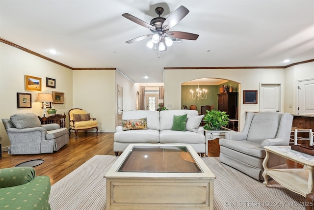 4733 S 167th E Pl, Tulsa, OK 74134 - living area featuring arched walkways, wood finished floors, ornamental molding, a ceiling fan, and recessed lighting