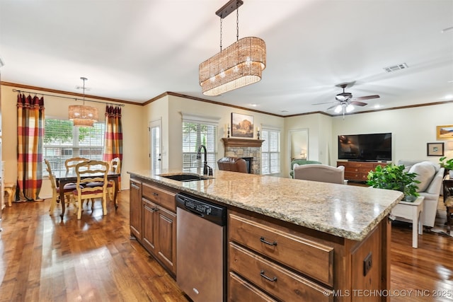 4733 S 167th E Pl, Tulsa, OK 74134 - kitchen featuring stainless steel dishwasher, open floor plan, dark wood-type flooring, a fireplace, and crown molding