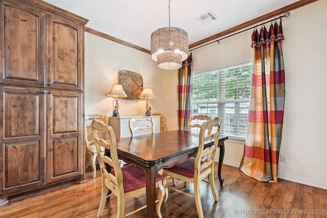 4733 S 167th E Pl, Tulsa, OK 74134 - dining room with a chandelier, ornamental molding, and light wood finished floors