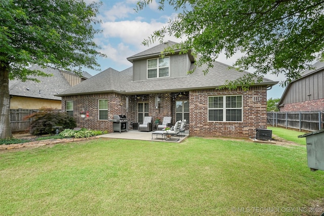4733 S 167th E Pl, Tulsa, OK 74134 - rear view of house with a patio, a fenced backyard, brick siding, and a shingled roof