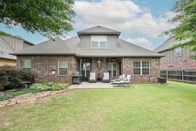 4733 S 167th E Pl, Tulsa, OK 74134 - rear view of house with brick siding, a patio, and roof with shingles