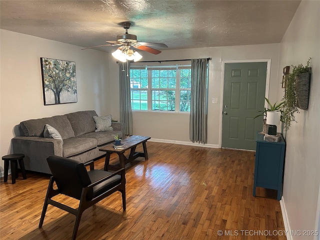 119 E Quesenbury, Sallisaw, OK 74955 - living area featuring wood finished floors, ceiling fan, and a textured ceiling