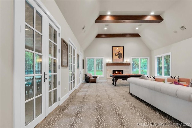 20565 E Clear Brook Rd, Owasso, OK 74055 - carpeted living room with french doors, beamed ceiling, a fireplace, plenty of natural light, and high vaulted ceiling