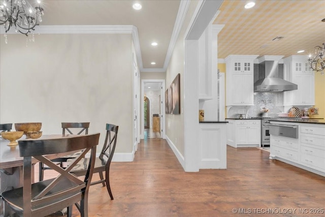 20565 E Clear Brook Rd, Owasso, OK 74055 - dining area with a chandelier, recessed lighting, ornamental molding, and dark wood-style flooring