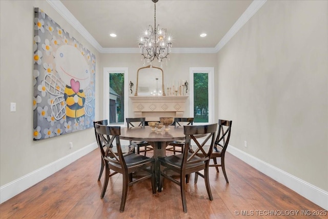 20565 E Clear Brook Rd, Owasso, OK 74055 - dining room featuring wood finished floors, a chandelier, ornamental molding, and recessed lighting