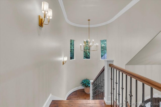 20565 E Clear Brook Rd, Owasso, OK 74055 - stairs featuring a chandelier, a towering ceiling, wood finished floors, and ornamental molding