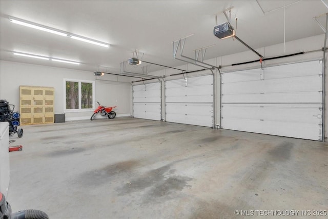 20565 E Clear Brook Rd, Owasso, OK 74055 - garage featuring a garage door opener