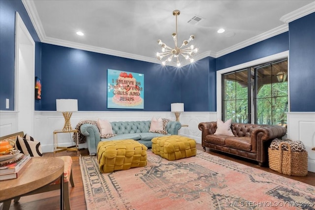 20565 E Clear Brook Rd, Owasso, OK 74055 - living area featuring a chandelier, wood finished floors, ornamental molding, a wainscoted wall, and recessed lighting