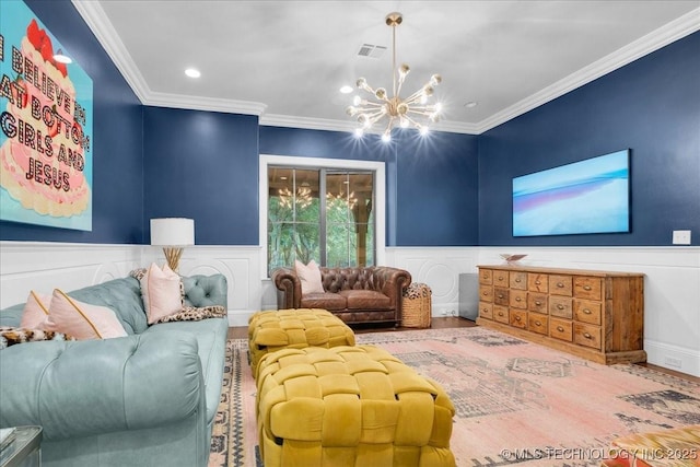 20565 E Clear Brook Rd, Owasso, OK 74055 - living room with crown molding, wood finished floors, a chandelier, a wainscoted wall, and recessed lighting