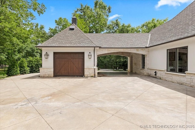 20565 E Clear Brook Rd, Owasso, OK 74055 - garage featuring concrete driveway