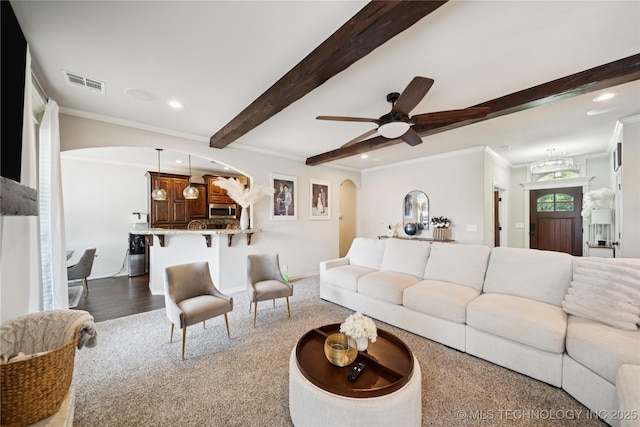 14400 E Willow Way, Claremore, OK 74019 - living area with arched walkways, recessed lighting, beamed ceiling, crown molding, and a ceiling fan