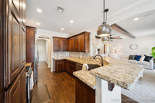 14400 E Willow Way, Claremore, OK 74019 - kitchen featuring arched walkways, a ceiling fan, a peninsula, recessed lighting, and light stone countertops