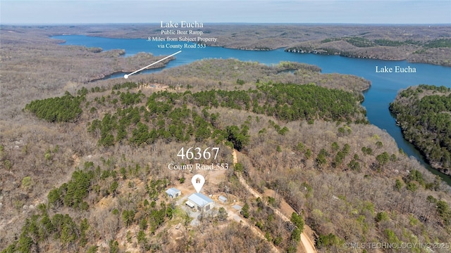 46367 County Road 553, Colcord, OK 74338 - aerial view of property's location with a nearby body of water and a heavily wooded area