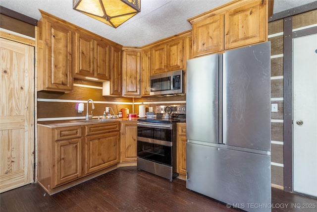 46367 County Road 553, Colcord, OK 74338 - kitchen with appliances with stainless steel finishes and dark wood finished floors