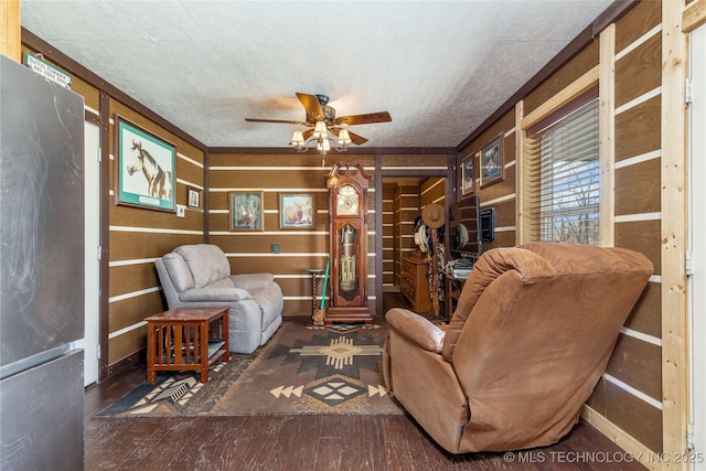 46367 County Road 553, Colcord, OK 74338 - living room featuring ceiling fan, wood finished floors, and wooden walls