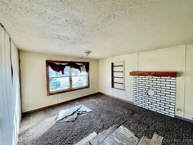 100 W Walnut Ave, Coalgate, OK 74538 - unfurnished living room featuring a textured ceiling and carpet floors