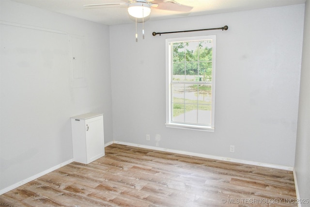 3180 E 2090th Rd, Hugo, OK 74743 - empty room featuring a ceiling fan, wood finished floors, and electric panel