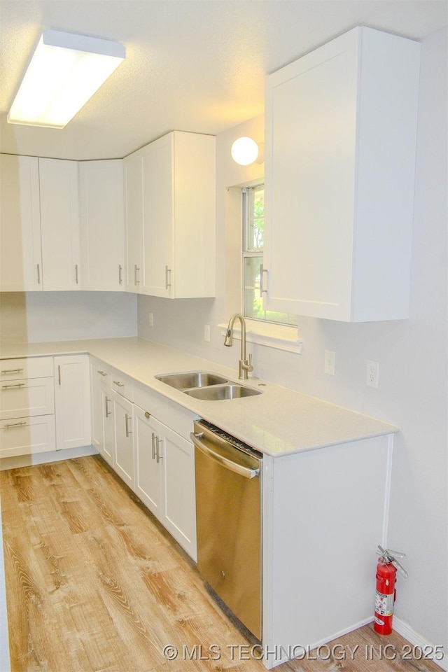 3180 E 2090th Rd, Hugo, OK 74743 - kitchen with dishwasher, white cabinetry, light countertops, and light wood-type flooring
