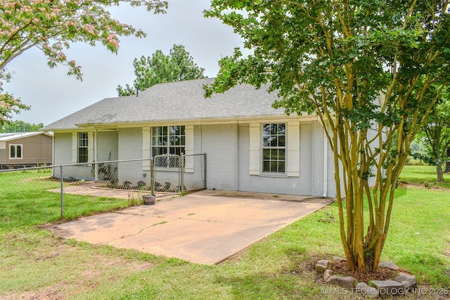 3180 E 2090th Rd, Hugo, OK 74743 - rear view of house with a patio area, brick siding, and a shingled roof