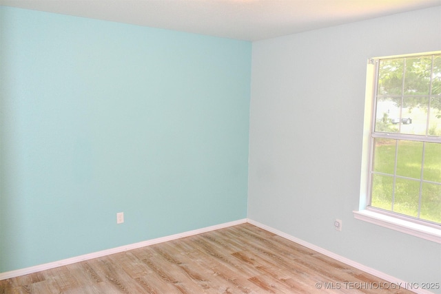 3180 E 2090th Rd, Hugo, OK 74743 - unfurnished room with plenty of natural light and light wood finished floors
