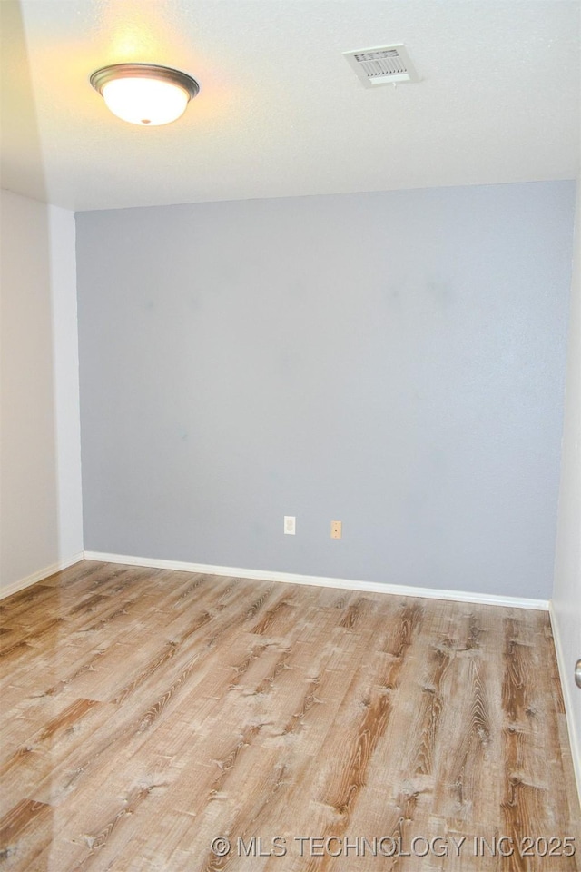 3180 E 2090th Rd, Hugo, OK 74743 - spare room with wood finished floors