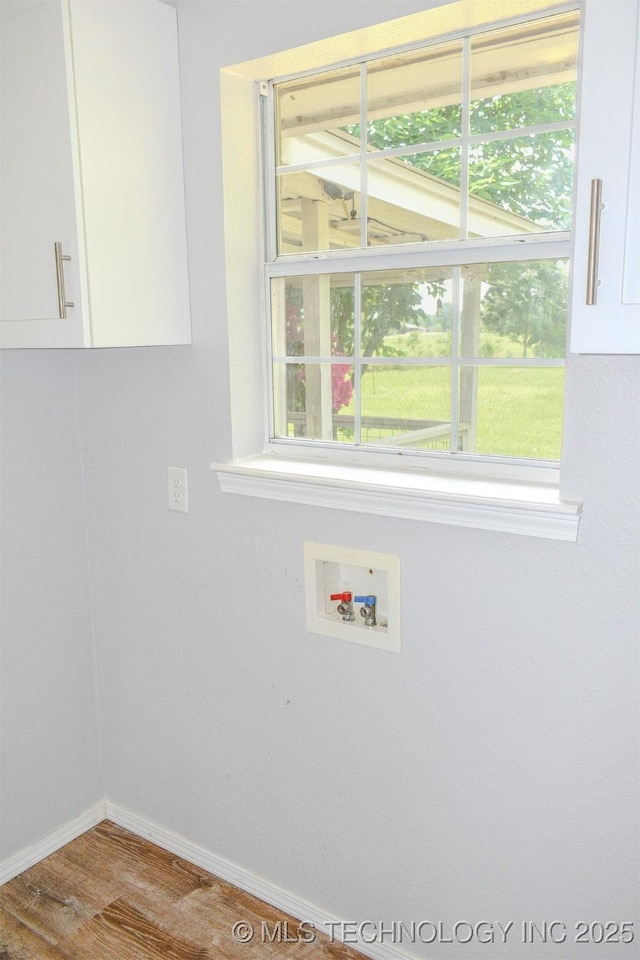 3180 E 2090th Rd, Hugo, OK 74743 - washroom with wood finished floors and washer hookup