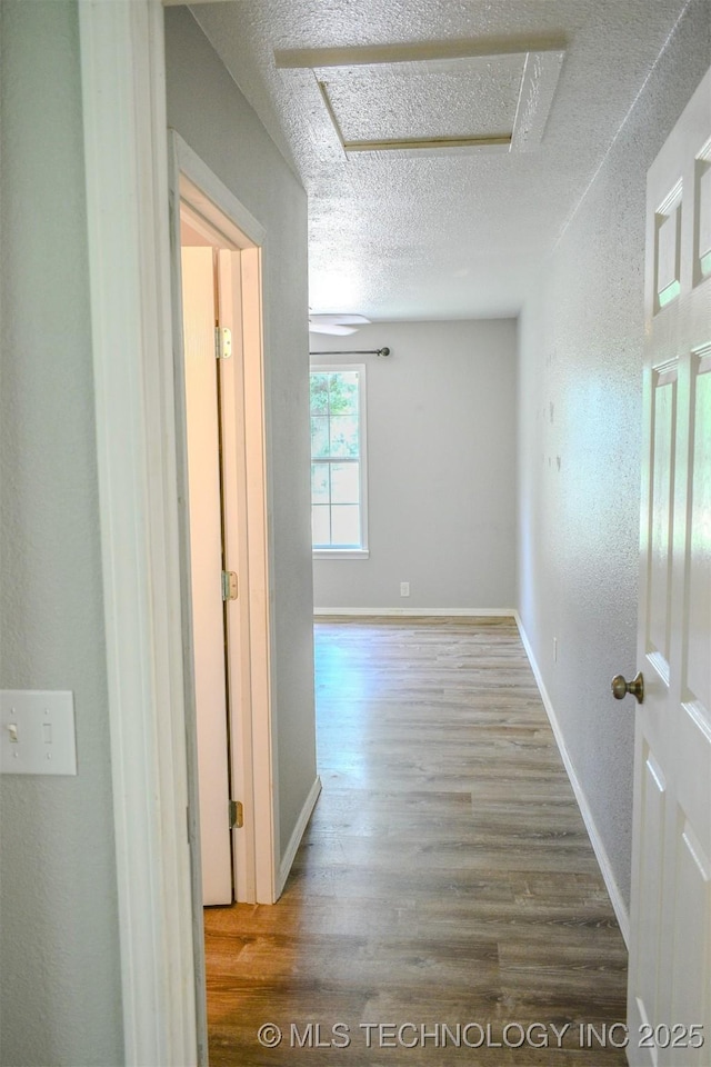 3180 E 2090th Rd, Hugo, OK 74743 - hallway with a textured ceiling and wood finished floors