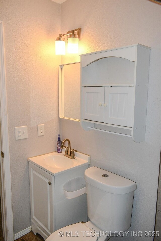 3180 E 2090th Rd, Hugo, OK 74743 - bathroom with vanity and toilet