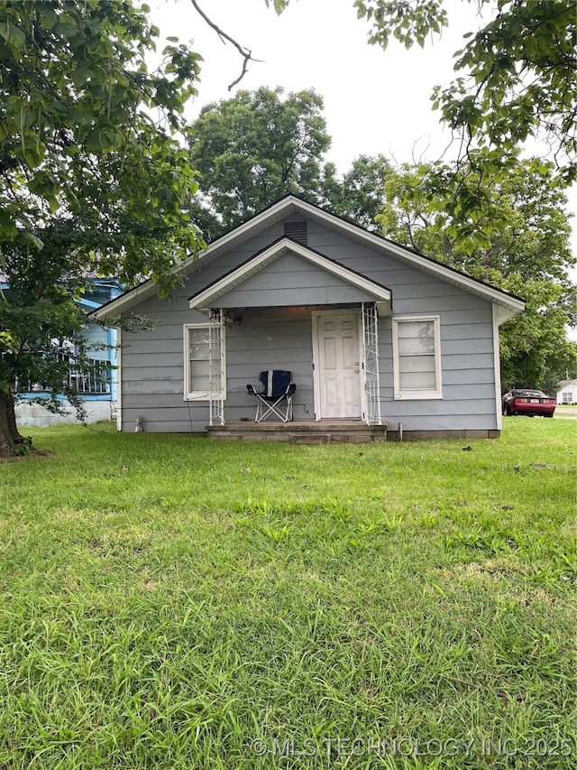 500 W 4th, Ada, OK 74820 - view of front facade with a front yard